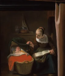 Jonge vrouw bij een wieg