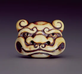 Netsuke die het gezicht van een oni-demon uitbeeldt, c.1870
