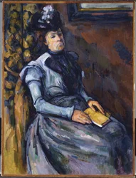 Zittende vrouw in blauw