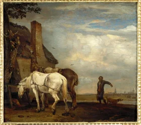 Twee paarden voor een boerderij