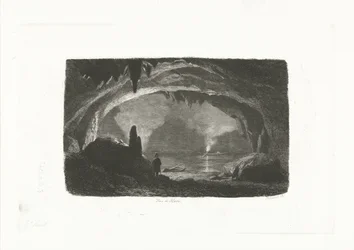 Man met roeiboot in de grotten van Han