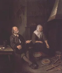 Oud echtpaar in hun keuken