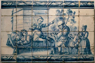 De dokter die een patiënt een klysma toedient - Satirisch paneel uit Lissabon, eerste helft van de 18e eeuw (Arts - Satirisch paneel, eerste helft van de 18e eeuw) - Nationaal Tegelmuseum, Lissabon (Portugal)