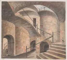 Het interieur van het opiummagazijn in Patna, met een trap die op steeds hogere bogen stijgt