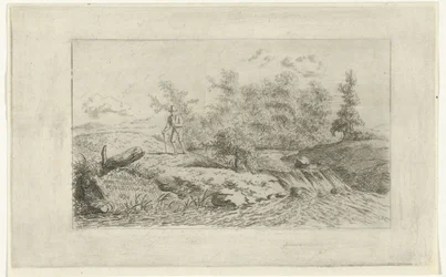 Man bij een waterval