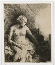 Een Vrouw bij het Bad met een Hoed naast Haar, 1658