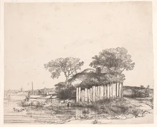 Huisje met een wit hekwerk