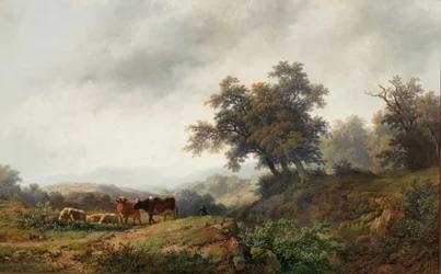 Open landschap met koeien en herder
