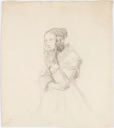 Vrouw leunt met haar kin op haar linkerhand