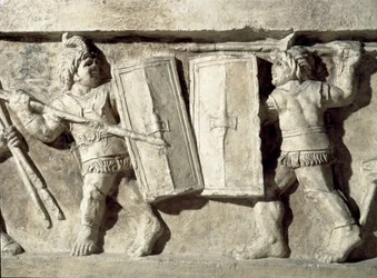 Romeinse kunst: laag reliëf dat een gladiatorengevecht voorstelt. 1e eeuw n.Chr. Rome, Museo della Civilta Romana