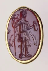 Intaglio in een gouden ring met jonge mannelijke figuur