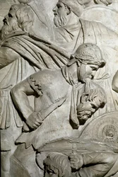 Romeinse kunst: Romeinse krijger die het hoofd van een vijandige krijger tussen zijn tanden houdt