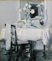 Een interieur met rozen in een vaas op een tafel