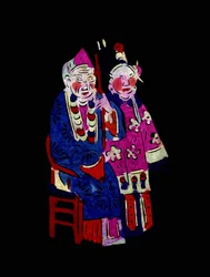 Paar in traditionele kleding. Geschilderd papierknipsel of "Jian Zhi", Chinese volkskunst, Pekin.