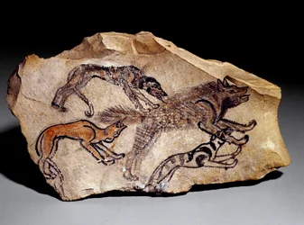 Honden jagen op hyena (Steengravure, ca. 1300-1100 v.Chr.)