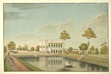 Calcutta huis omgeven door een tuin met tank en bijgebouwen