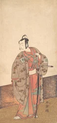 De acteur Ichikawa Danjuro V staand in een huis en voor een engawa, ca. 1772