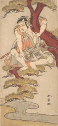 De acteur Otani Hiroemon III kijkt vanuit de takken van een dennenboom