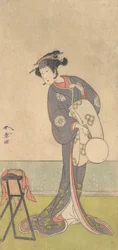 De eerste Nakamura Tomijuro als een Oiran die in een kamer staat