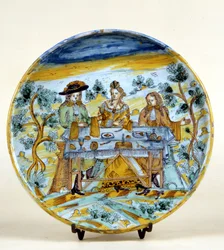 Afbeelding van een buitenbanket op een keramische plaat van Talavera de la Reina (Spanje). Begin 16e eeuw. Milaan, Museo del Castello.