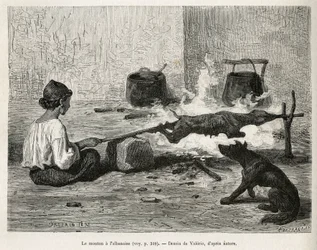 Een jonge Montenegrijn braadt met de Albanees een schaap, zittend voor het vuur en voortdurend het houten spit draaiend. Gravure naar een tekening van Valerio, ter illustratie van de reis naar Dalmatië door Charles Yriarte in 1874, gepubliceerd in 