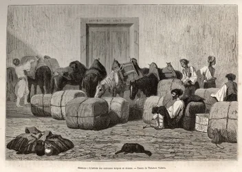 Wanneer Turkse karavanen aankomen bij de douane van Sebenico (Servië), lossen commerciële reizigers de balen van de rug van hun kamelen om de hoeveelheid en aard van de goederen te verifiëren. Gravure naar de tekening van Theodore Valerio, ter illustratie 
