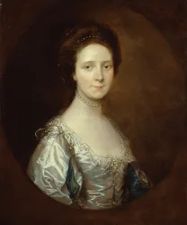 Elizabeth Parry in een witte jurk en blauwe mouwen