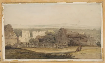 Een groot gebouw met boerderijgebouwen en een kerkruïne