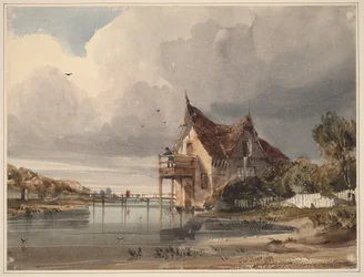 Een rivier en een cottage met een wit hek