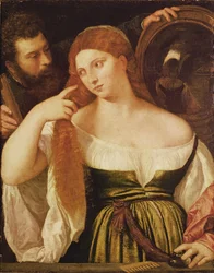 Vrouw die haar haar kamt