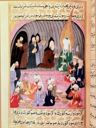 De Profeet Mohammed (Mohammed of Mohammed) (570-632) (bedekt gezicht) op een reis naar Syrië wordt verwelkomd door christelijke monniken die hem een Turkse Miniatuur maaltijd serveren uit de 18e eeuw. Topkapi Museum, Istanboel Turkije