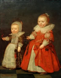 Twee kleine meisjes, staande volledige figuren naar links