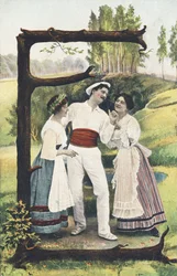 E : Een man in wit en rood staat tussen twee vrouwen in rok, lijfje en schort. Landelijke omgeving - Alphabet personages Ref Th. E., L. Theochrom - Serie 994. Theodor Eisman, uitgever, Leipzig