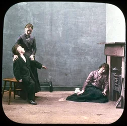 Twee vrouwen en jongen voor de open haard, ca. 1895