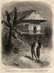 Een stel Indianen uit Rio Verde (Brazilië) de man met zijn blaaspijp, voor een typisch huis op palen. Gravure ter illustratie van de reis naar Nieuw-Granada, door Dr. Saffray, in 1869, gepubliceerd in 