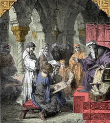 Alchemie en astrologie onderwezen in de scholen - Wetenschappelijk onderwijs in de middeleeuwen: een leraar geeft een lezing over astronomie en alchemie aan jongeren