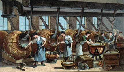 Mechanische fabricage van dragees. Chromolithografie uit het einde van de 19e eeuw
