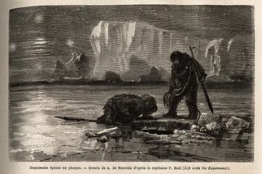 Eskimo jagers bespioneren een zeehond door een hol gat in het pakijs, wachtend bij het graf van de nacht om het te harpoeneren. Gravure ter illustratie van de reis naar de vrije zee van de Noordpool, door dokter Hayes, chirurg van de Amerikaanse marine, in