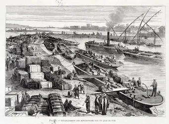 Lossen van goederen op een dok in het Suezkanaal
