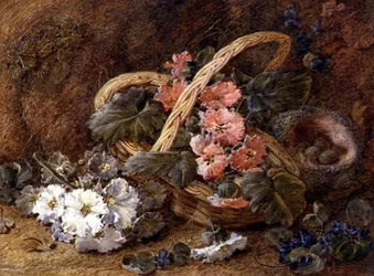 Een vogelnest en een mand met bloemen