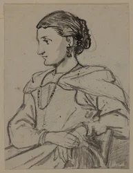 Zittende vrouwenfiguur