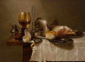 Een stilleven met een Roemer, een omgevallen zilveren Tazza, een fluit, een broodje en ham op een tafel