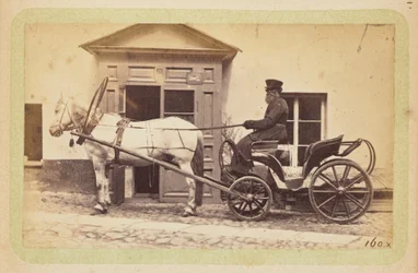[Man die paard-en-wagen rijdt]