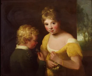 Twee kinderen met een mand bloemen