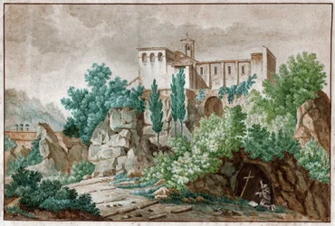 Een klooster in Italië. Pelgrim aanbidt het kruis van Jezus Christus in een grot.